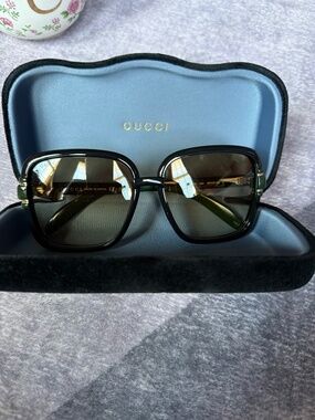 Gucci sunglasses green and gold